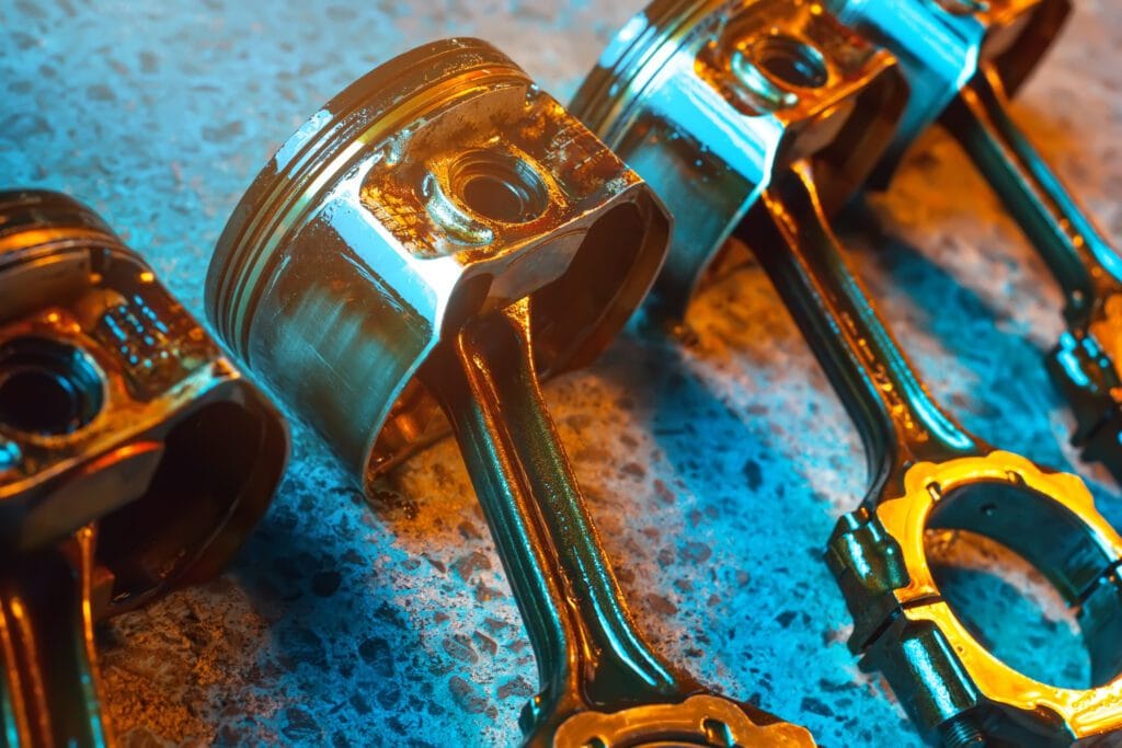 Professional mechanic inspecting engine components covered by extended warranty